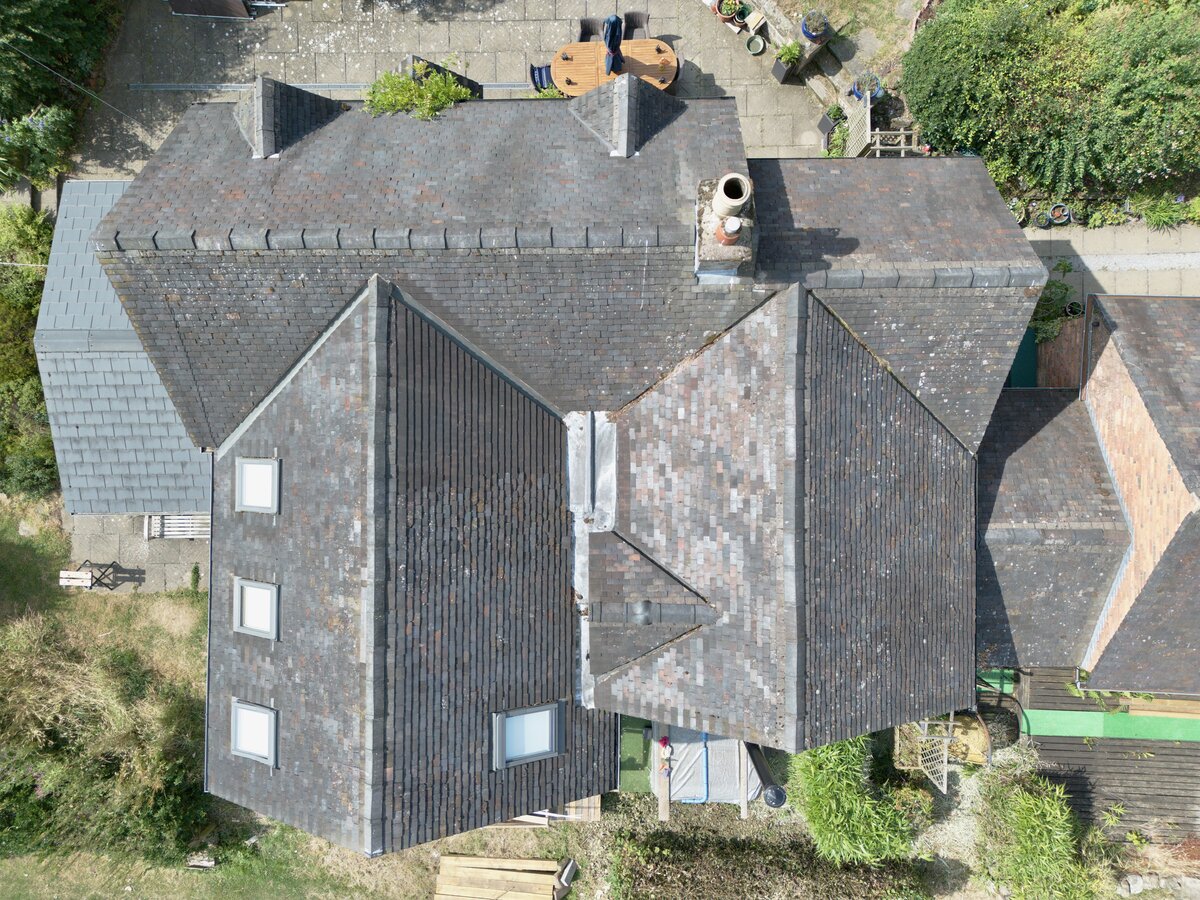 Aerial view of a rural estate roof and adjoining property